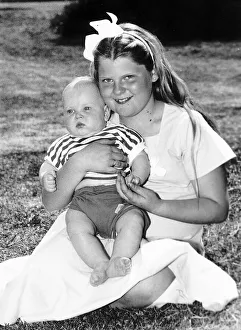 00174 Prints: Louise Brown Test Tube Girl holding 6 month old Andrew Machea on her lap May 1989