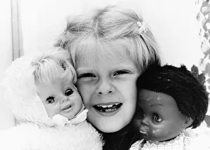 00029 Prints: Louise Brown Test Tube Girl holding dolls July 1984