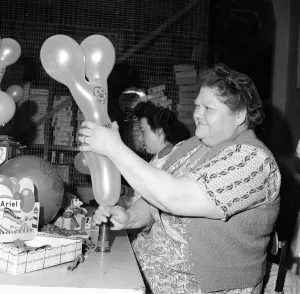 00192 Prints: Louise German carries out quality control on Ariel Christmas Balloons December 1953