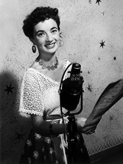 Screen Prints: Louise Traill Actress next to a BBC microphone September 1958