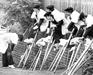 A Large Group Of People Prints: Lous Cigalouns de Mourseuns stilt walkers from France mount up