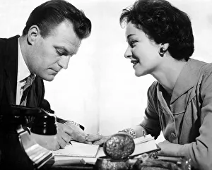 Secretaries Prints: Love at the office - secretary typist office worker making romantic overtures to her boss