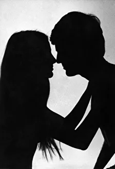 00103 Prints: Love and Romance silhouette of a couple about to embrace - kiss Feburary 1979