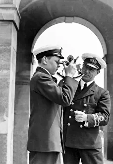 Navigation Prints: Lt. Commander J. H. Blair D. C. S. seen here teaching a naval cadet how to use a sexton
