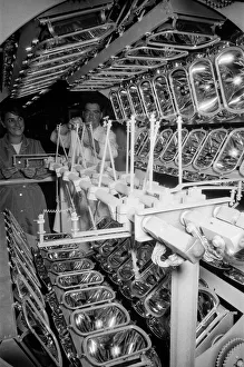 Lucas Prints: Lucas factory. Operators in the illuminating department where head lamp reflectors are