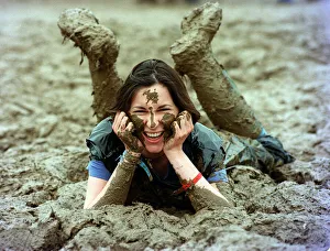 Wellies Prints: Lucy Rock enjoying the mud at Glastonbury festival June 1997