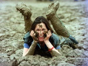 Lucy Rock enjoying the mud at Glastonbury festival June 1997