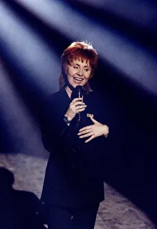 Lulu singer & actress singing at a Royal Command Performance on stage with microphone