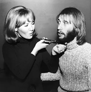 Lulu singer giving husband Maurice Gibb of the Bee Gees a shave