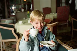 Movies Prints: Macaulay Culkin sips his tea as he toasts his membership of he million-dollar-a movie