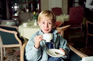 Macaulay Culkin sips his tea as he toasts his membership of he million-dollar-a movie