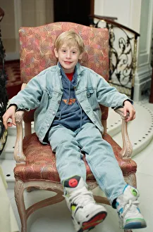 Macaulay Culkin sips his tea as he toasts his membership of he million-dollar-a movie
