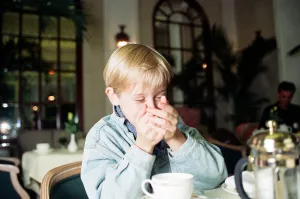 00456 Prints: Macaulay Culkin sips his tea as he toasts his membership of he million-dollar-a movie