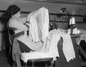 01299 Prints: Machinist assembles a lace cardigan at The Shawl Factory of GH Hurt