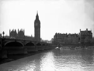 Big Ben Prints: Mad Major Christopher Draper flying under Westminster Bridge in an Auster aircraft