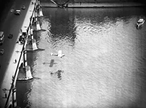 Mad Major Christopher Draper flying under Westminster Bridge in an Auster aircraft