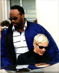 Madonna Singer Actress with burly minder leaving Lanesboruogh hotel