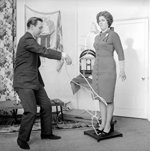 00844 Prints: Magician Bernard Hughes performing rope trick with female assistant