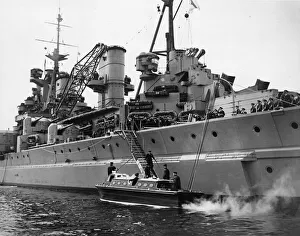 His Majesty King George VI leaves the Royal Navy Battleship HMS King George V after