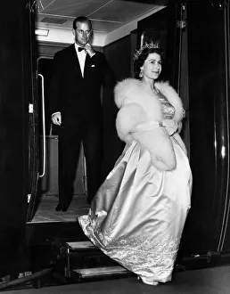 1961 Prints: Her Majesty Queen Elizabeth II, followed closely behind by her husband Prince Philip