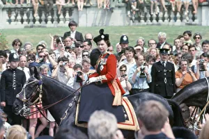 01522 Prints: Her Majesty Queen Elizabeth II rides on horseback through The Mall in Central London