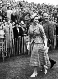 Her Majesty Queen Elizabeth II smiles after making a presentation to the Argentina polo