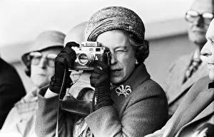 Her Majesty Queen Elizabeth II taking a picture at the Royal Windsor Horse Trials