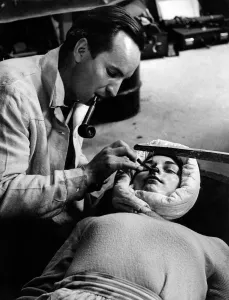 Special Effects Prints: Make up artist John Lee who specialises in creating facial masks is seen here carefully