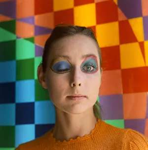 Colourful Prints: Make up artist Paul Richards of Eylure demonstrates his panda look on model Penelope Tree