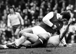 Footballers Prints: Malcolm McDonald Football Player of Arsenal - is about to punch Kevin Beattie of