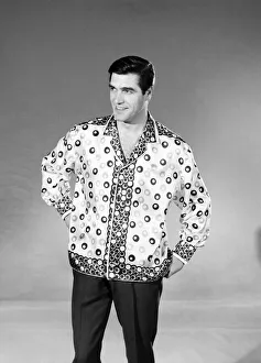 Male model Peter Christian wearing silk shirt. Circa 1964
