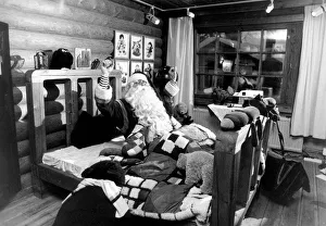 00264 Prints: Man dressed as Father Christmas in bed. 2nd January 1991