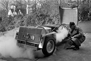 00044 Prints: Man driving a steam powered car near his home December 1970 70-11615-002