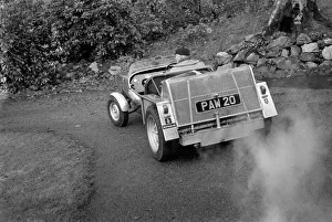 Alternative Prints: Man driving a steam powered car near his home December 1970 70-11615
