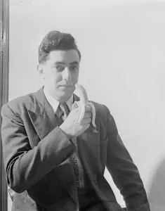 00123 Prints: Man eating a banana. 27th April 1953 to illustrate the easing of rationing