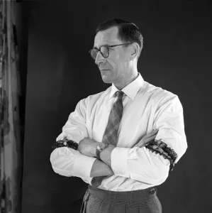 Man with garters for armbands circa 1959