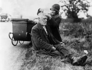 Grooming Prints: A man gets a haircut on the Newmarket Road. 5th November 1934