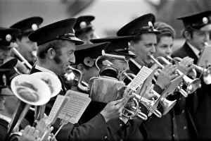 Man playing the kettle for the Pilling Jubilee Silver Band