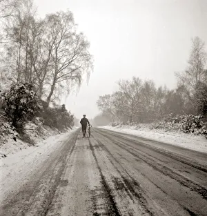 Landscapes And Gardens Prints: Man pushing bicycle along muddy country lane Countryside road Snow snowy