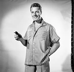 Man wearing shorts sleeve shirt. 1960