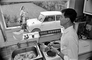A man a woman living in a sububan area of Manchester at home