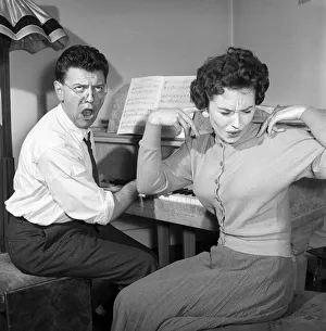 00091 Prints: Man, Woman, Singing: Wife puts her fingers in her ears to block out her husband