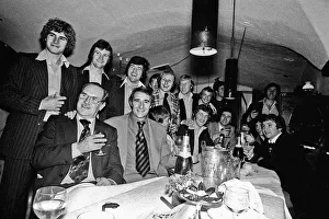 Manager Malcolm Allison with his Crystal Palace team relaxing in a bar drinking champagne