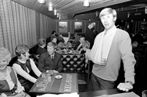 Manchester City and England star Colin Bell nursing his damaged shoulder