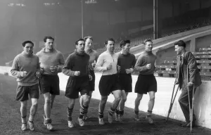 Jogging Prints: Manchester City football players pictured during training session as they jog around
