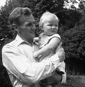 Manchester City footballer Don Revie pictured with his son Duncan in the back garden of