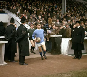 Manchester City footballer John Crosson walks out of the tunnel onto the pitch before his