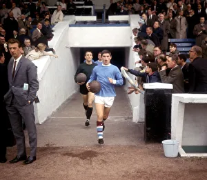 Manchester City footballer Johnny Crossan leads out his team for their match against