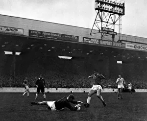 00238 Prints: Manchester City goalkeeper Bert Trautmann dives and saves at the feet of Dawson of