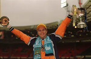 Manchester City keeper Nick Weaver celebrates May 1999 with trophy folowing